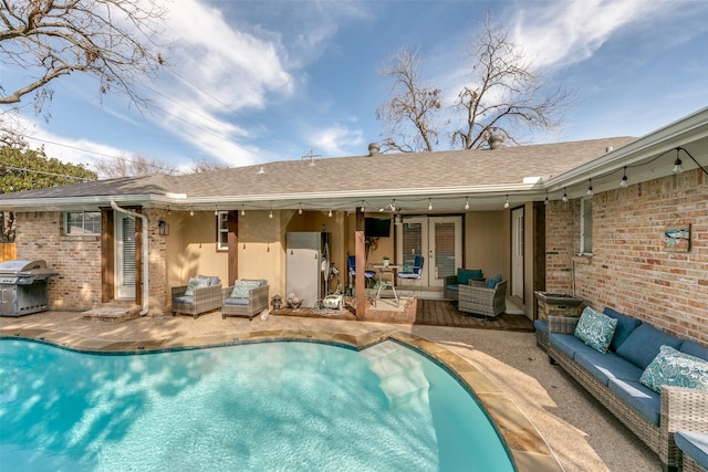 rear view of property with ceiling fan, an outdoor hangout area, and a patio area