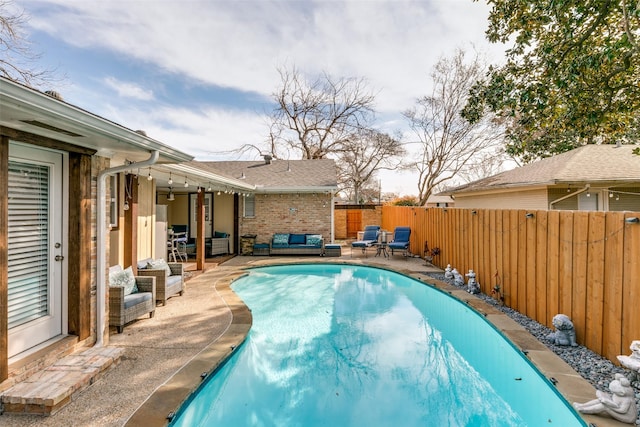 view of pool with a patio area and outdoor lounge area