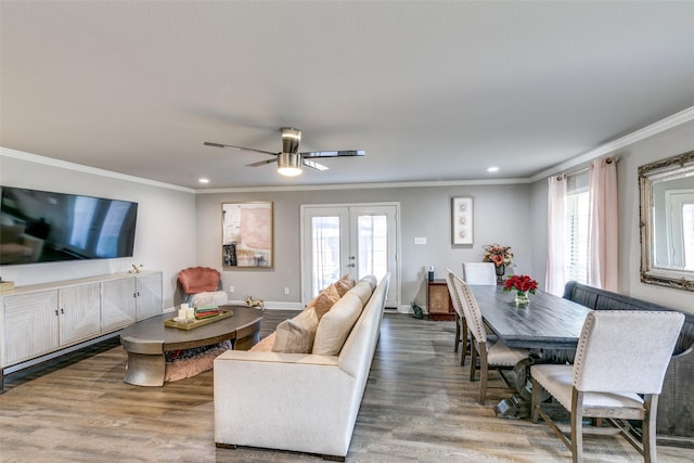 living room with french doors, crown molding, a healthy amount of sunlight, and dark hardwood / wood-style floors