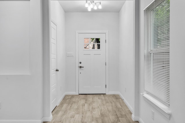 doorway with light wood-type flooring