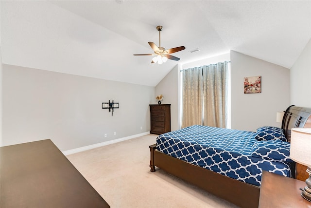 carpeted bedroom with ceiling fan and lofted ceiling