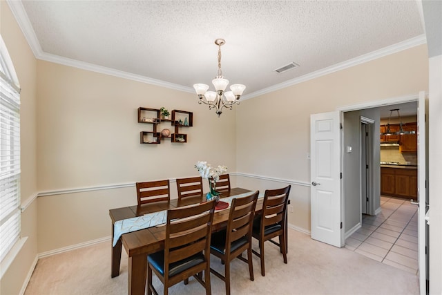 carpeted dining room featuring a wealth of natural light, crown molding, and an inviting chandelier