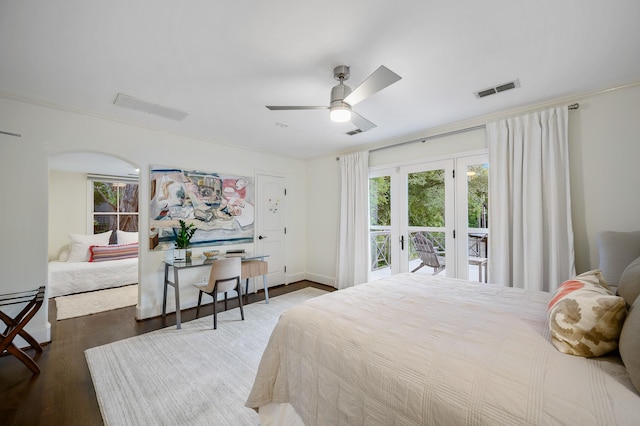 bedroom featuring access to outside, ceiling fan, and dark hardwood / wood-style flooring