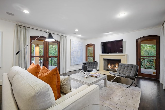 living room featuring crown molding, french doors, and hardwood / wood-style flooring