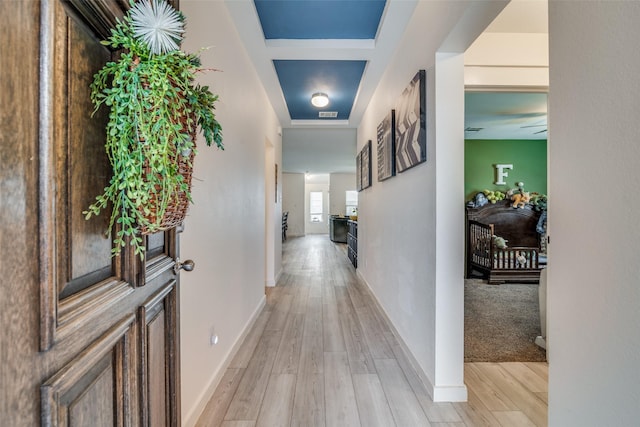 hall with light wood-type flooring