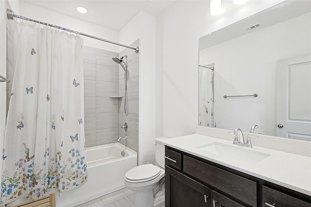 full bathroom featuring tile patterned flooring, vanity, toilet, and shower / tub combo with curtain