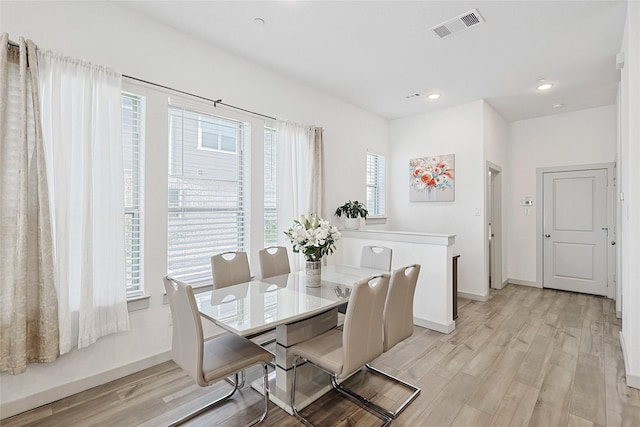 dining area featuring light wood-type flooring