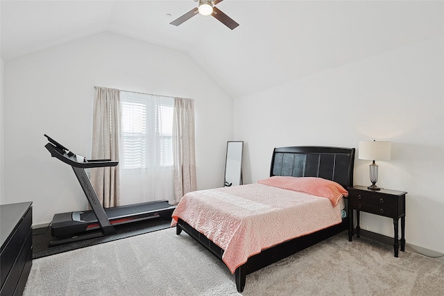 carpeted bedroom featuring vaulted ceiling and ceiling fan