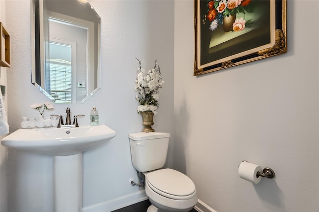 bathroom with sink and toilet