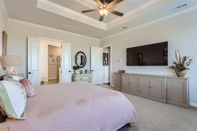 bedroom with ceiling fan, light colored carpet, ensuite bath, crown molding, and a tray ceiling