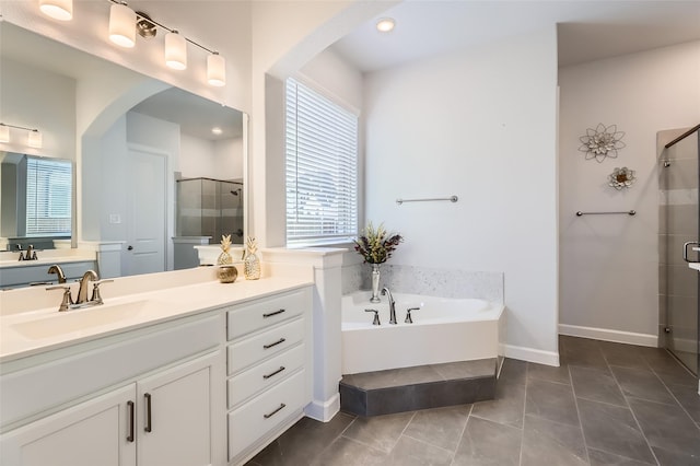 bathroom featuring vanity, tile patterned flooring, and independent shower and bath