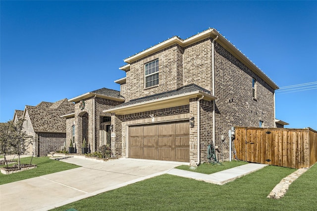 view of front facade featuring a front lawn and a garage