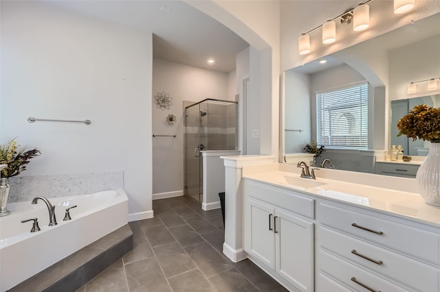 bathroom with separate shower and tub, vanity, and tile patterned flooring