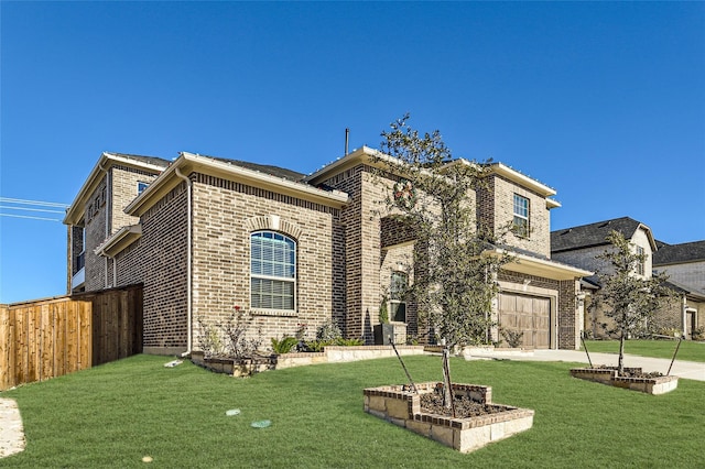 view of front of property with a garage and a front lawn