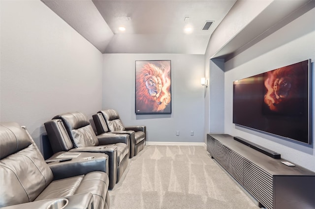 carpeted cinema room featuring lofted ceiling