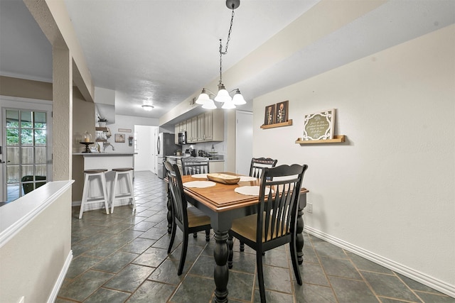 dining space featuring an inviting chandelier