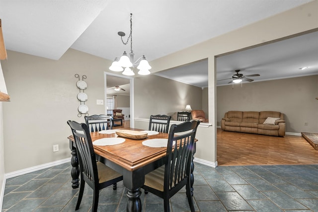 dining space featuring ceiling fan with notable chandelier