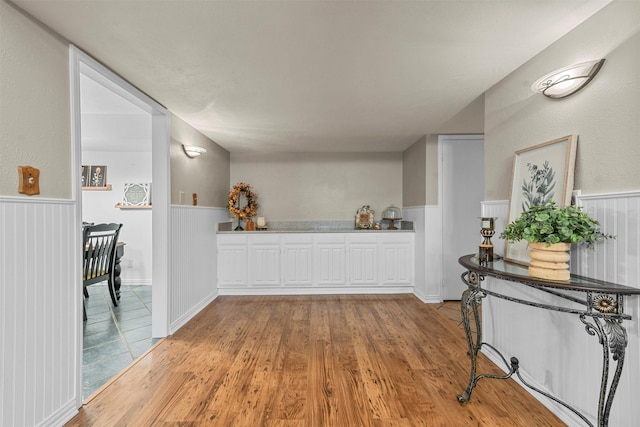 hallway with light hardwood / wood-style floors