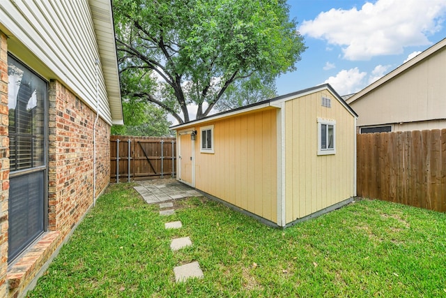 view of outbuilding with a lawn