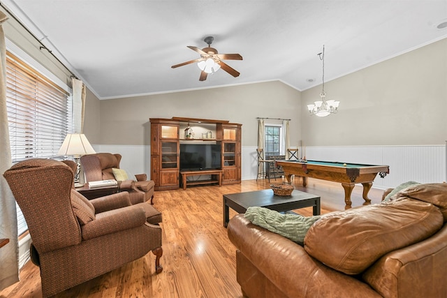 living room featuring light wood-type flooring, ornamental molding, ceiling fan with notable chandelier, billiards, and lofted ceiling