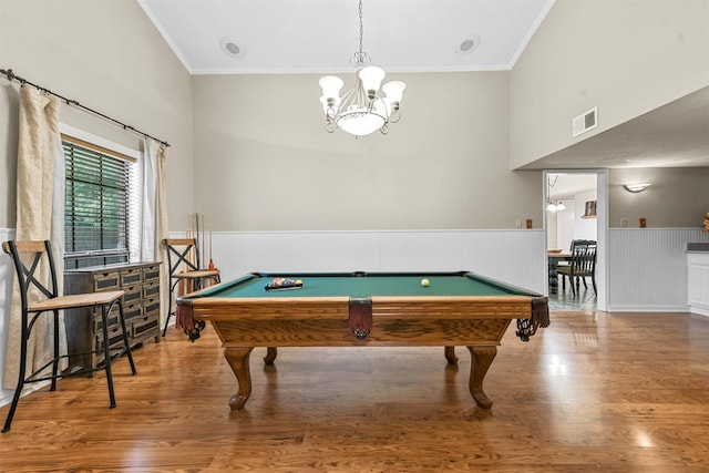 playroom with hardwood / wood-style floors, a notable chandelier, crown molding, and billiards