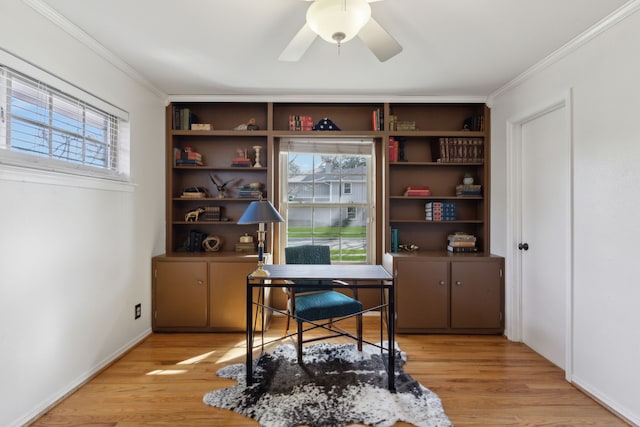 home office with ornamental molding, ceiling fan, light hardwood / wood-style flooring, and plenty of natural light