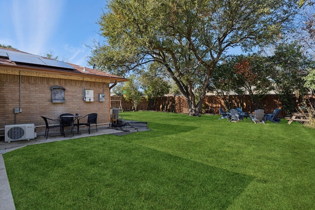 view of yard featuring ac unit and a patio