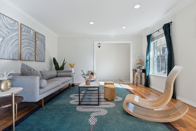 living room with crown molding and hardwood / wood-style flooring