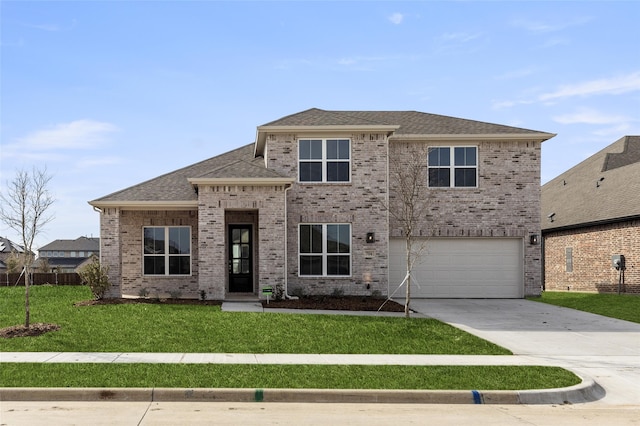 view of front facade with a front yard and a garage