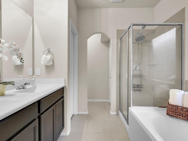 bathroom with separate shower and tub, vanity, and tile patterned floors