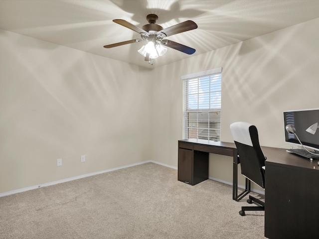 office space with ceiling fan and light carpet