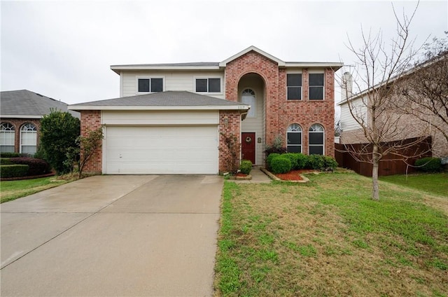 view of front of home featuring a front yard and a garage