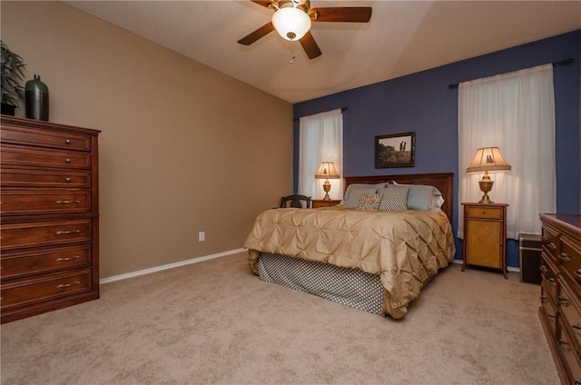 carpeted bedroom with ceiling fan and lofted ceiling