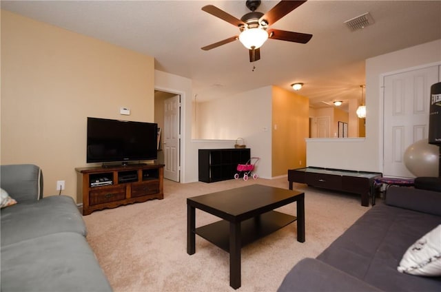 living room with ceiling fan and light carpet