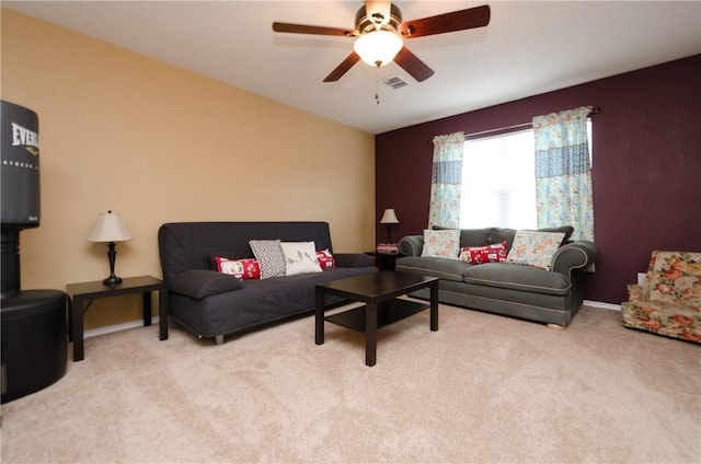 living room with ceiling fan and light colored carpet