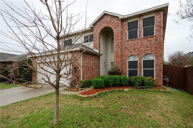 view of front of house with a garage and a front lawn