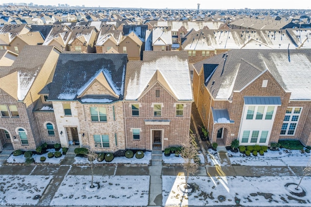 view of front of home with a residential view and brick siding