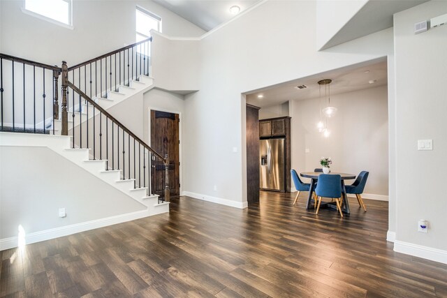 dining area featuring dark wood-type flooring