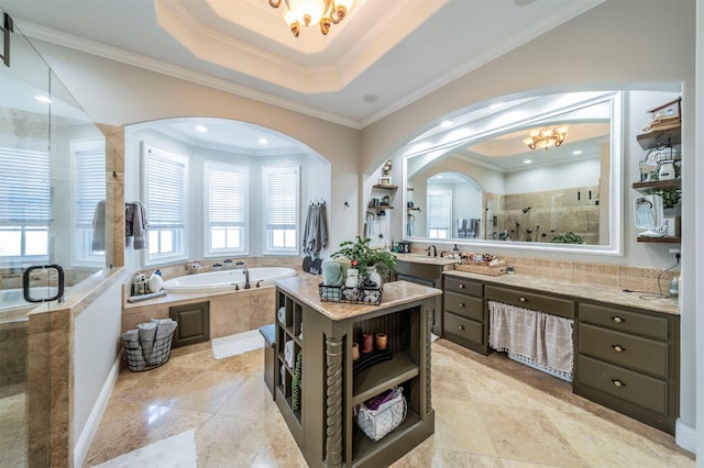 bathroom with a notable chandelier, ornamental molding, shower with separate bathtub, and a tray ceiling