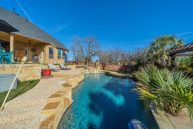 view of swimming pool with ceiling fan and a patio