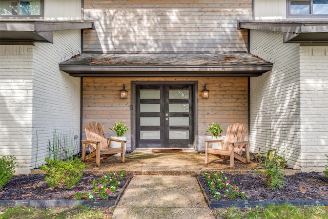 view of exterior entry featuring french doors