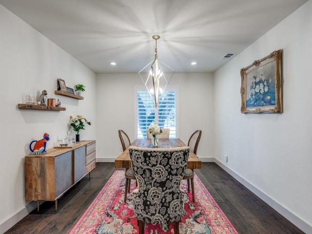 dining space with a chandelier and dark wood-type flooring