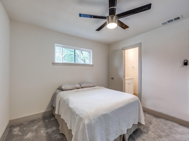 bedroom with carpet, ceiling fan, and ensuite bathroom