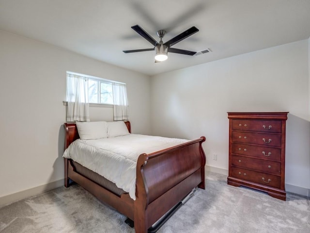 bedroom with light carpet and ceiling fan