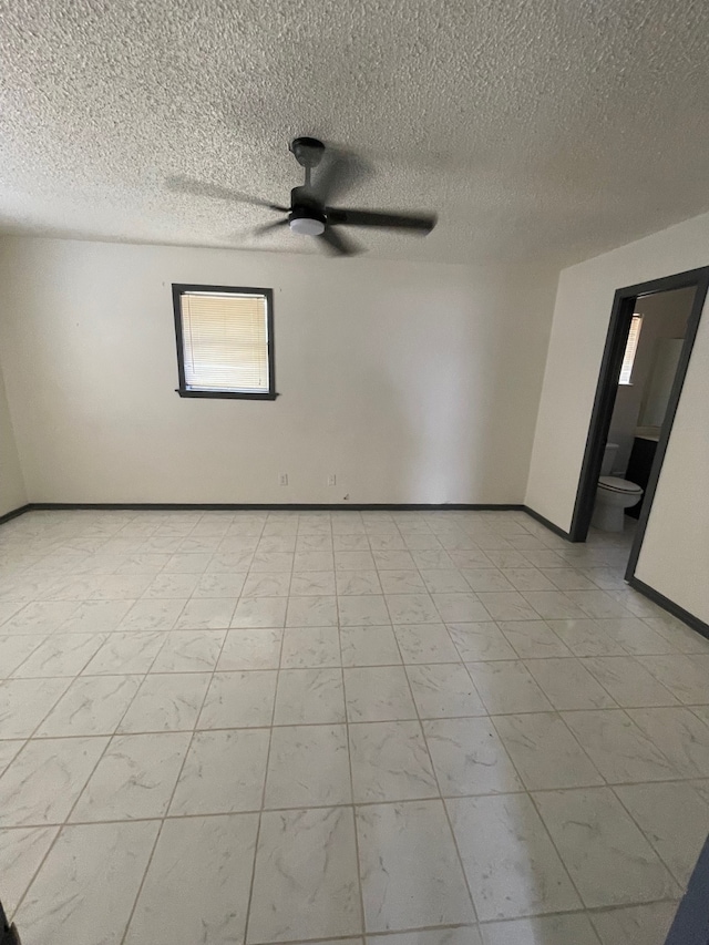 spare room featuring ceiling fan