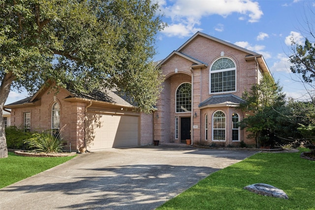 front facade with a front lawn and a garage