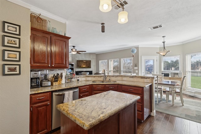 kitchen featuring dark wood-type flooring, sink, dishwasher, and a center island