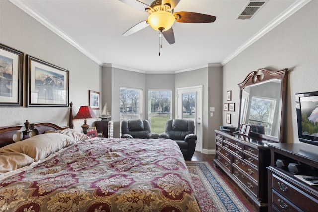 bedroom with dark wood-type flooring, ceiling fan, and crown molding