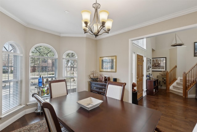 dining area with dark hardwood / wood-style floors, crown molding, and a chandelier