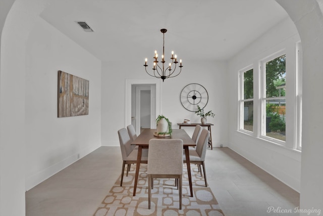 dining space with plenty of natural light and a chandelier